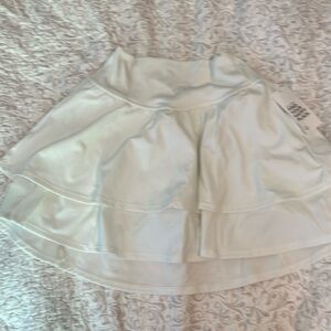White/cream built-in shorts workout skirt from Gilly Hicks extra small